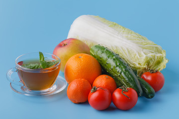 Fresh juices measuring tape fruits and vegetables lose weight diet concept