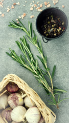 Fototapeta na wymiar Top view rosemary condiments ingredients garlic and seasoning
