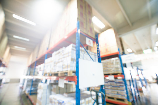 Blurred indoor warehouse with box on shelf
