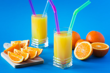 Orange juice isolated on blue background