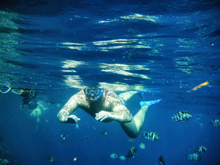 Deep blue Sea. The guy has been snorkeling.