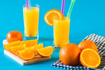 Orange juice isolated on blue background