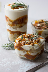 Dessert bowl with tasty caramel parfait on table.
