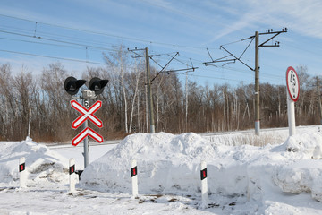 sign adjustable railway crossing equipped with a semaphore, signal columns.