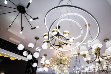 modern chandeliers on the ceiling, demonstration samples for buyers