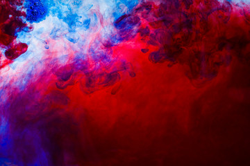 colorful paints dissolve in water, abstract background