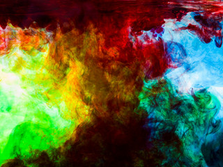 Different colored paints in water, abstract background