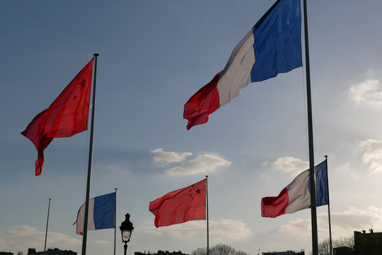 French and Chinese flags in Paris
