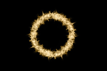 Golden powder explosion on black background. Freeze motion.