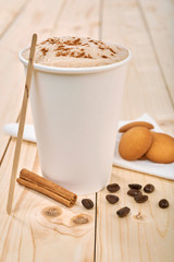 coffee with cookies on a wooden table