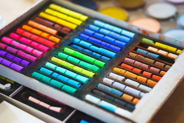 Pastel crayons paint special palette box.  Accessories and tools of the artist for drawing.