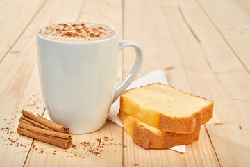 coffee with pound cake on wooden table