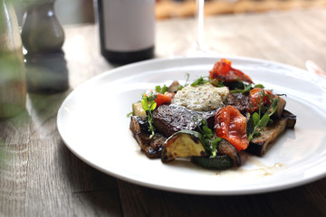 Beef steak with herb butter and grilled vegetables
