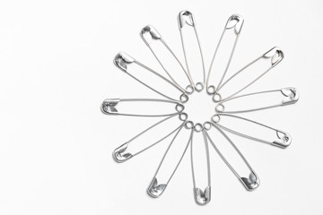 safety pin,  with space for text