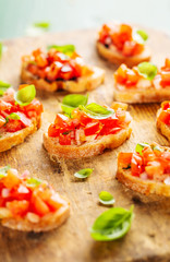Classic italian bruschetta served on wooden board