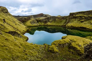 Tjarnargigur Crater filled with water is one of most impressive craters of Lakagigar volcanic fissure area in Southern highlands of Iceland.
