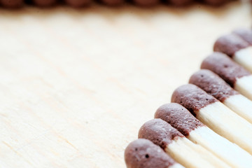 Ordinary matches are on the diagonal on a light background. A mountain of simple unlit matches. Fire safety concept.