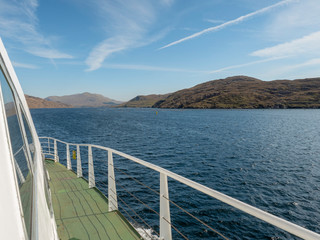 Fototapeta na wymiar Bank of Killary fjord, sunny day, view from a ship.County Galway, Ireland.