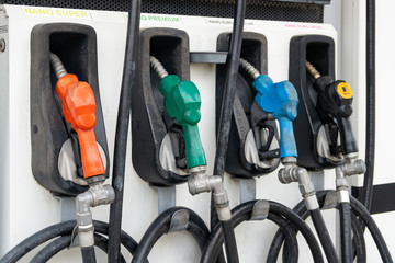Colorful Petrol pump filling nozzles, Gas station in a service