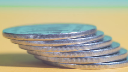 money, coins are shown in ascending order, concept of wealth growth, warm gamma