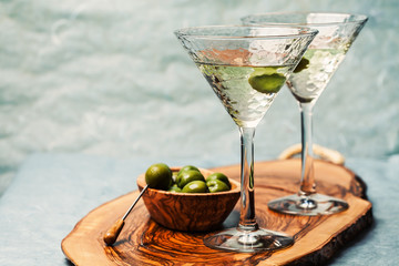 Martini cocktail with green olive