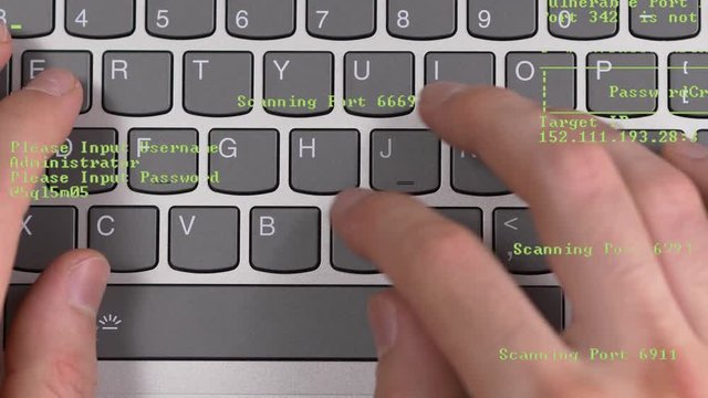 Haker computer keyboard top view. Green coding appearing on the screen showing the hacking process.