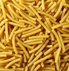 Macaroni raw pasta background and texture, top view