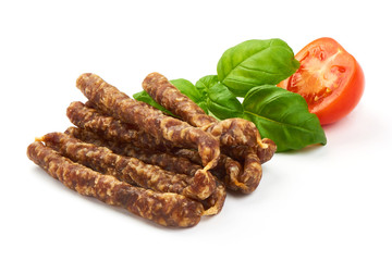 Dry wild meat sticks. Jerky sausages close-up, isolated on white background