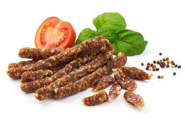 Dried thin pork sausages, smoked meat, close-up, isolated on white background