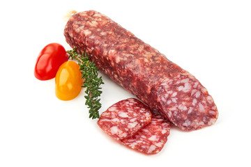 Italian jerked sausage. Tasty dried sausage, close-up, isolated on white background
