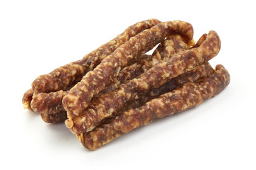Dried thin pork sausages, smoked meat, close-up, isolated on white background
