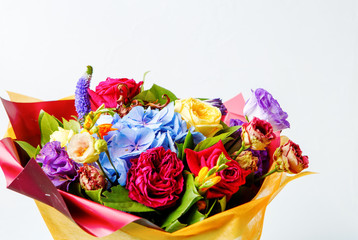 Bouquet of multicolored roses on empty white background