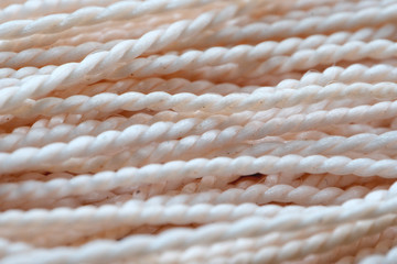 Threads are light. The texture of the rope. Close up. Textured image of threads. Macro mode.