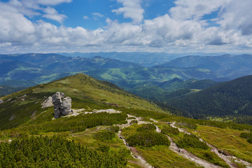 Summer landscape in mountains and the dark blue sky