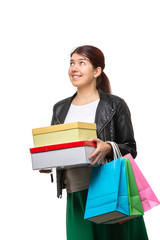 Happy young woman with shopping bags and boxes