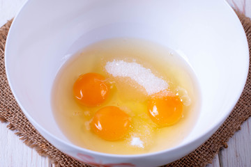 Cooking, egg yellow on white sugar for baking cookies