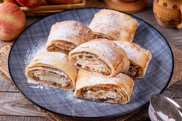 Traditional piece of apple strudel with powdered sugar
