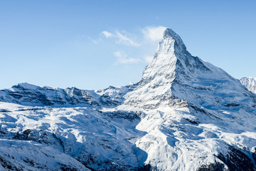 Stunning view of winter Matterhorn mountain landscape in sunny bright day