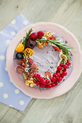 raw vegan cake with fruits and seeds