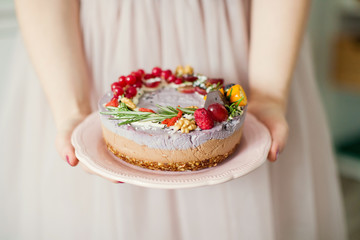 raw vegan cake with fruits and seeds