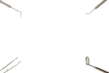 Basic dental instruments for dental examination on a white background. With copy space