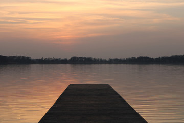 Obraz na płótnie Canvas Beautiful sunset by the lake