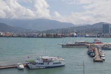 Fototapeta premium Batumi bay with boats in late afternoon Georgia. View of the embankment