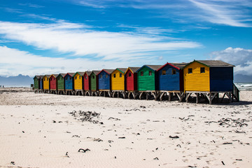 Naklejka premium Row of colorful bathing huts in Muizenberg beach, Cape Town, South Africa