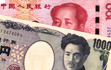 Japanese yen banknote and chinese yuan currency
