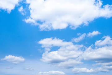 Naklejka na ściany i meble White clouds on the blue sky forming interesting shapes