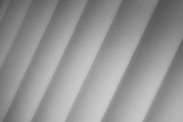 Elegant striped grey background pattern fading into white space