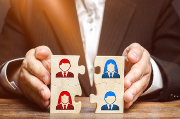 Businessman collects puzzles symbolizing the team of employees. Combining teams and people to perform work. The combination and selection of personnel for specific work. project management