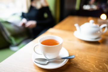 cup of tea at cafe blurred background