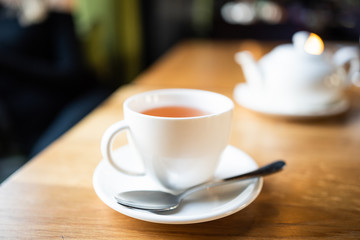 cup of tea at cafe blurred background